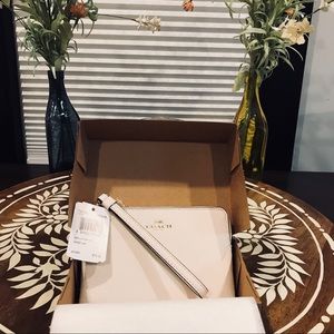 Brand new in the box white leather coach wristlet